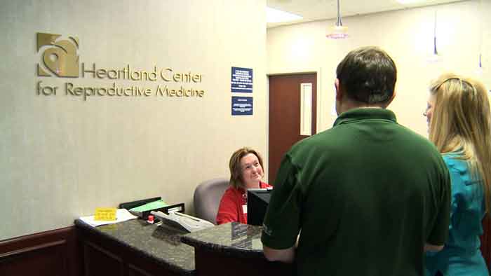 Patients meeting with receptionist at our front desk